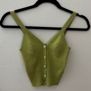A super cute green cropped button up tank. A size S never worn!